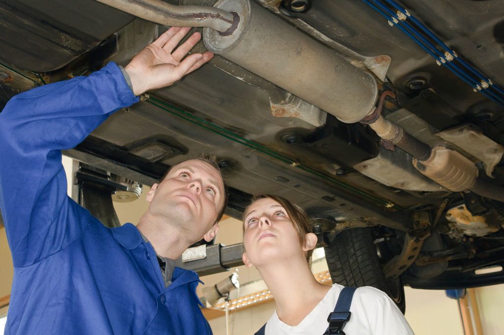 auto repair mechanic checking possible issues